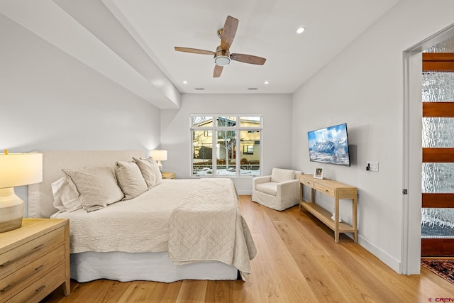 bedroom featuring ceiling fan and light hardwood / wood-style floors