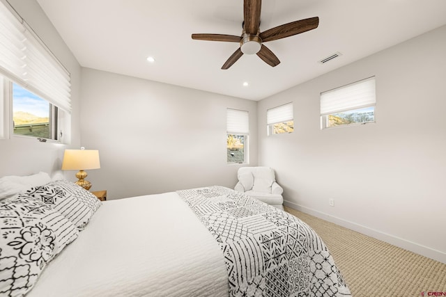 carpeted bedroom featuring ceiling fan