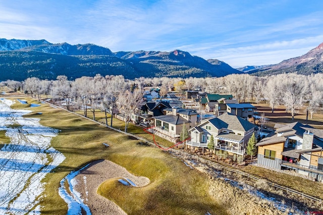 drone / aerial view featuring a water and mountain view