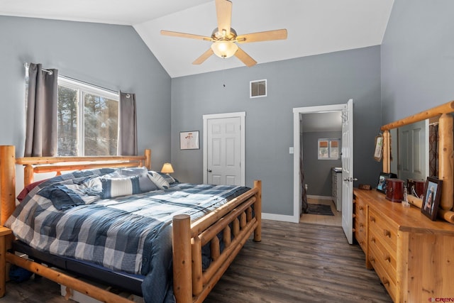 bedroom with dark hardwood / wood-style floors, vaulted ceiling, and ceiling fan