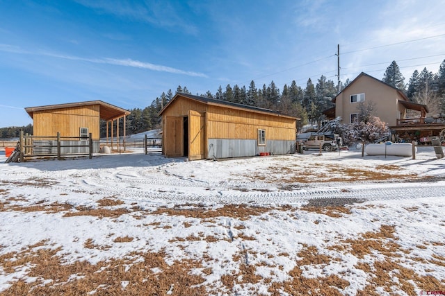 view of snow covered garage