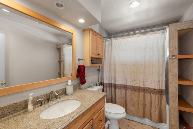 full bathroom featuring tile patterned floors, vanity, shower / tub combo, and toilet