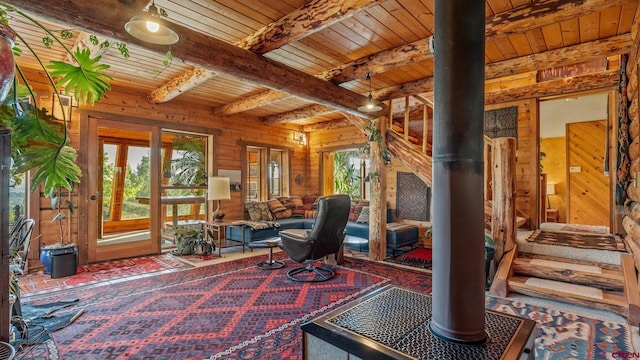 office area with rustic walls, french doors, wooden ceiling, beamed ceiling, and wood walls