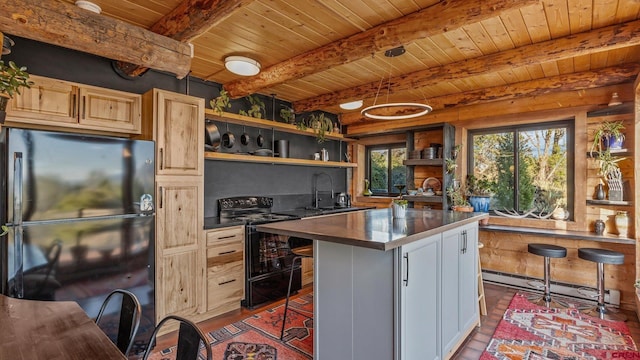 kitchen featuring beam ceiling, a center island, light brown cabinets, a breakfast bar area, and black appliances