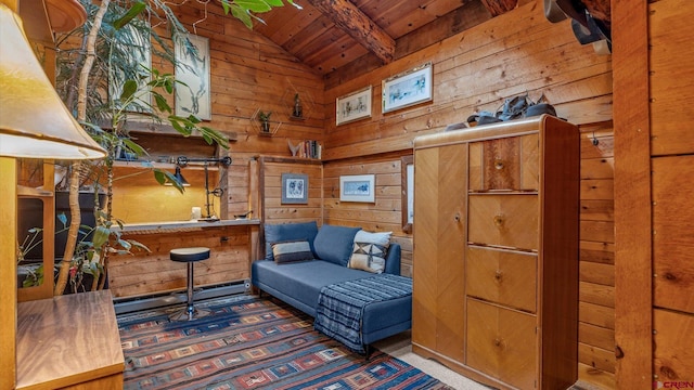 living area with vaulted ceiling with beams, wood ceiling, and wood walls