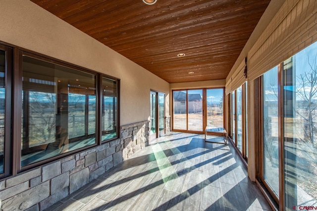 unfurnished sunroom featuring wood ceiling