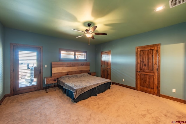 carpeted bedroom featuring ceiling fan