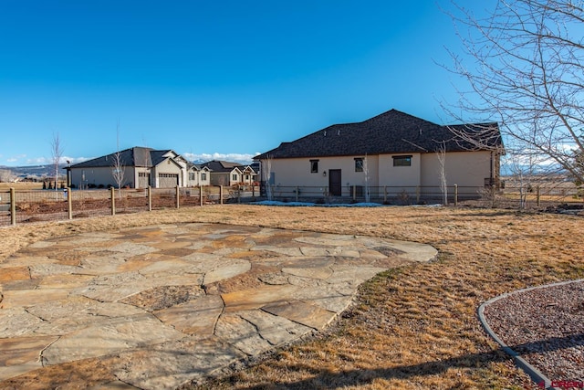 rear view of property featuring a patio