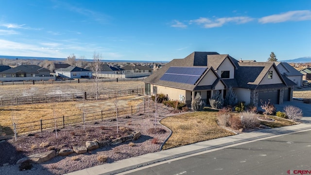 view of front of house with solar panels