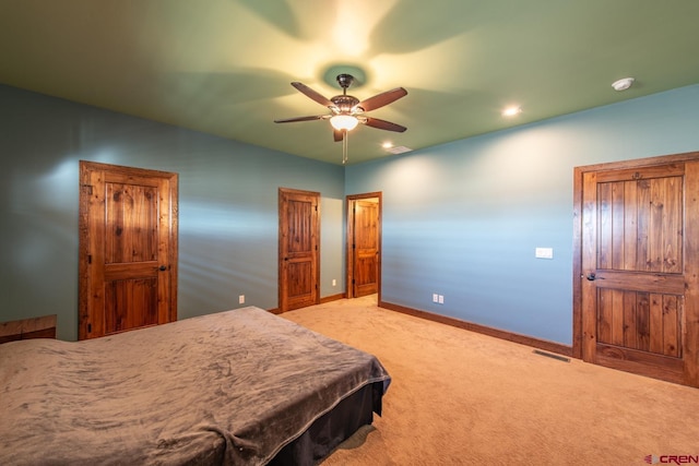 carpeted bedroom with ceiling fan and pool table