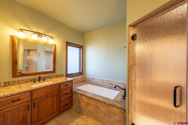 bathroom featuring tile patterned flooring, vanity, and shower with separate bathtub