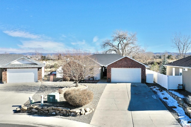 view of front of property featuring a mountain view and a garage