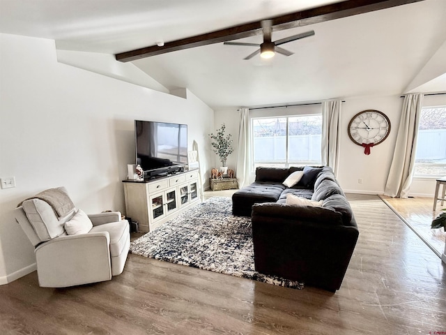 living room with lofted ceiling with beams, hardwood / wood-style flooring, plenty of natural light, and ceiling fan