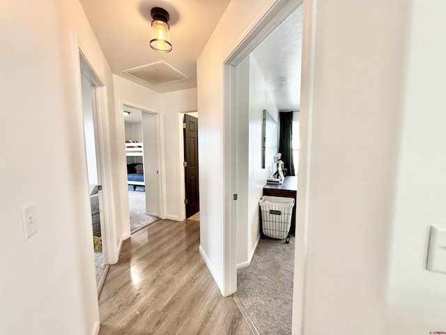 corridor featuring light hardwood / wood-style flooring