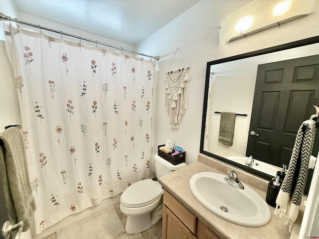 bathroom featuring tile patterned flooring, vanity, toilet, and curtained shower