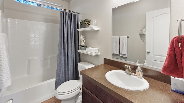 full bathroom with vanity, shower / bath combination with curtain, and toilet