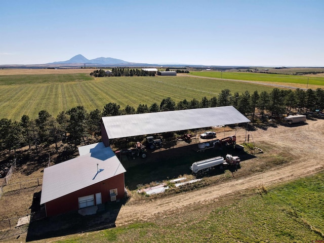 birds eye view of property featuring a mountain view and a rural view