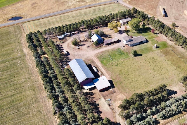 birds eye view of property with a rural view