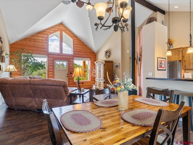 dining space with log walls, a chandelier, dark hardwood / wood-style floors, and high vaulted ceiling