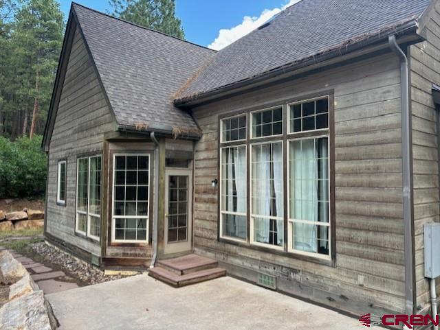 back of house with a patio