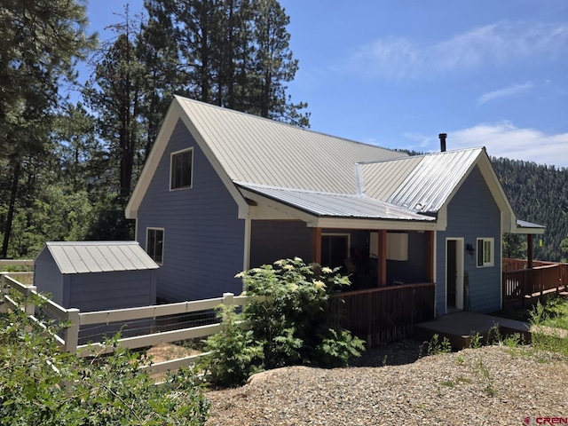 view of home's exterior with a shed