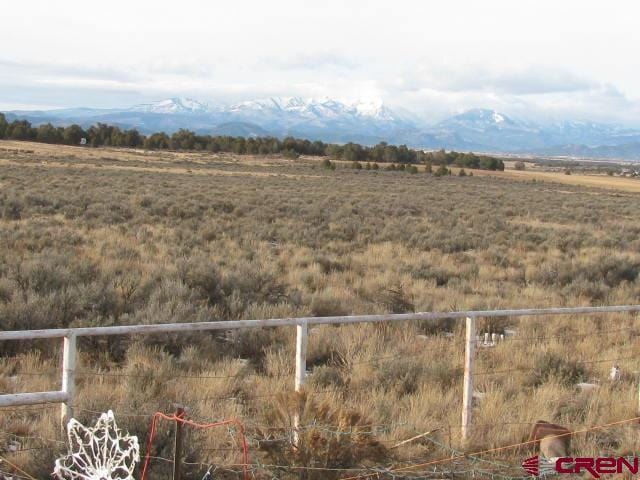 view of mountain feature with a rural view