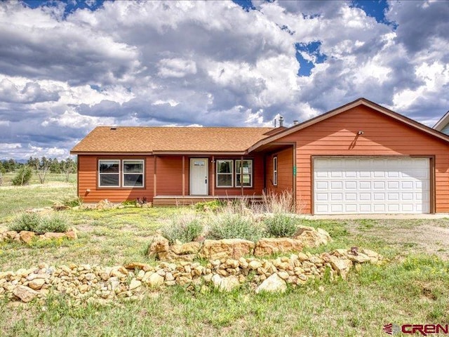 single story home featuring a garage