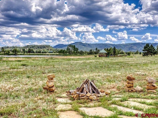 property view of mountains featuring a rural view