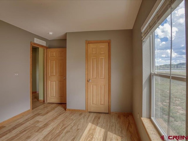 unfurnished bedroom featuring light hardwood / wood-style floors