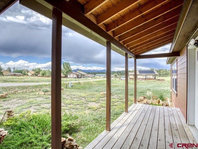 wooden deck with a yard