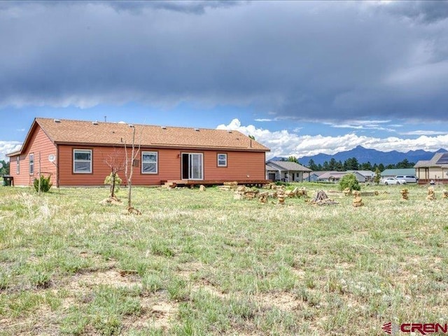 rear view of property with a mountain view