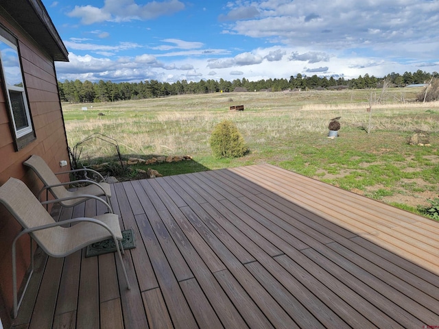 wooden deck with a rural view