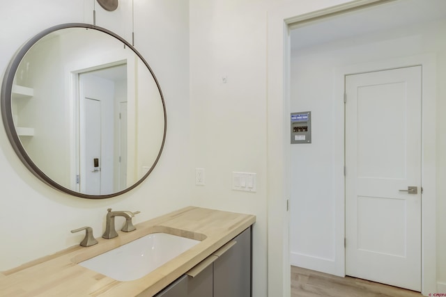 bathroom featuring hardwood / wood-style floors and vanity