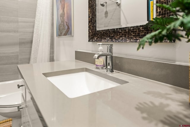 bathroom featuring vanity and toilet