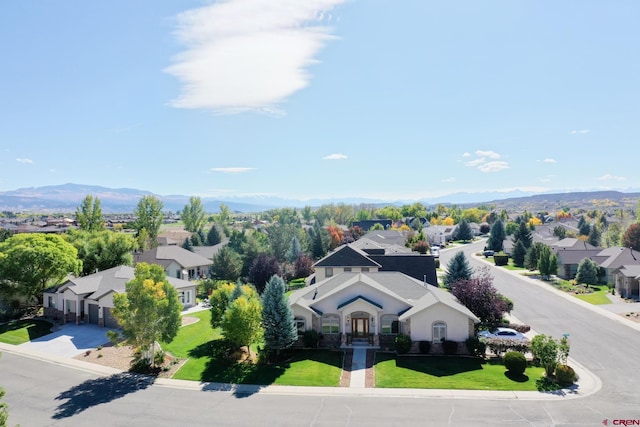 birds eye view of property featuring a mountain view