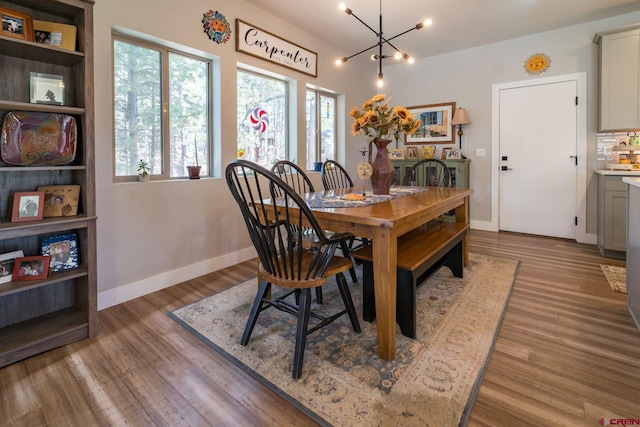 dining area featuring a chandelier and light hardwood / wood-style floors