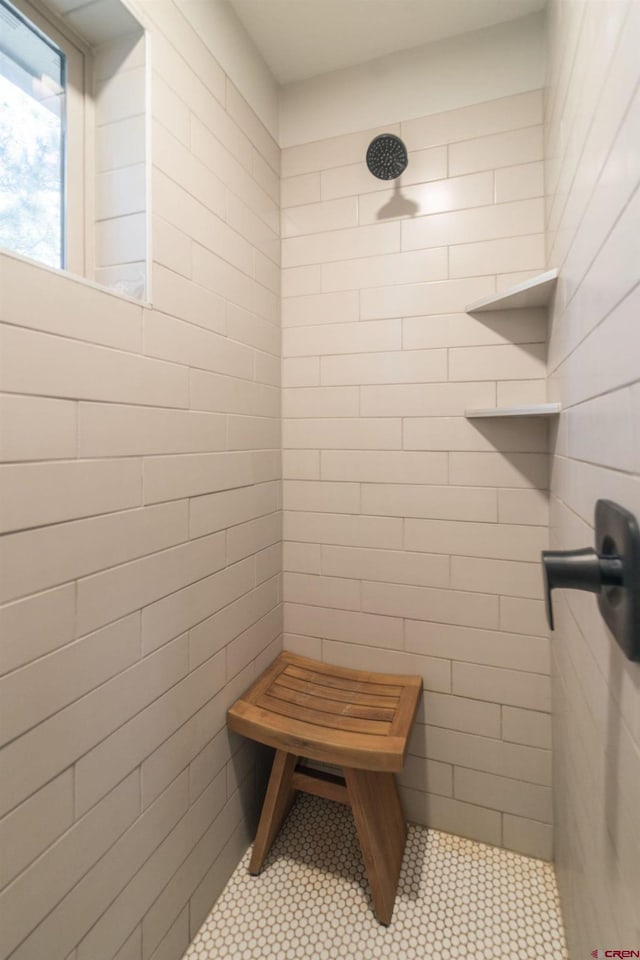 bathroom with tiled shower