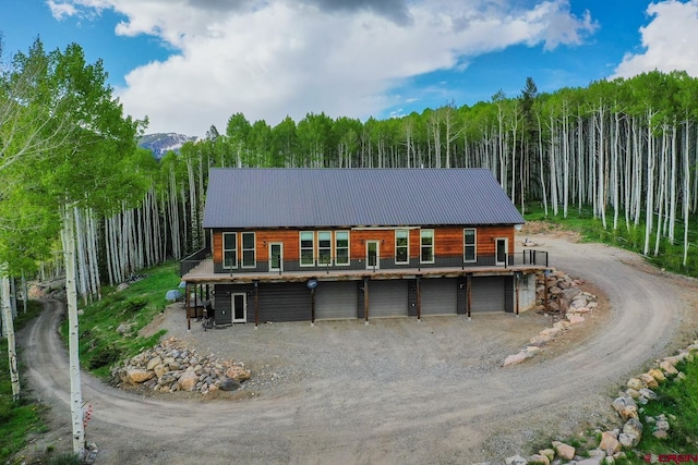 back of house featuring a garage