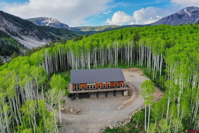 birds eye view of property featuring a mountain view