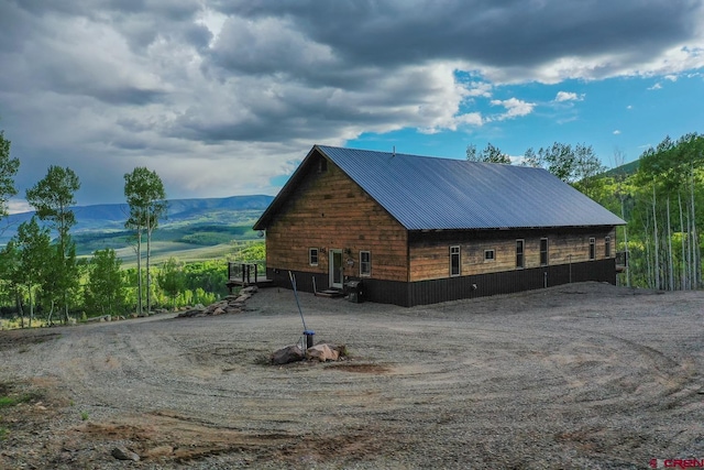 view of property exterior featuring a mountain view