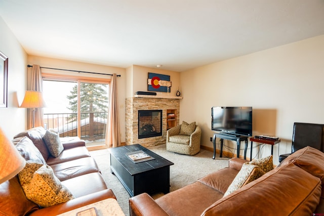 living room featuring a stone fireplace and light carpet