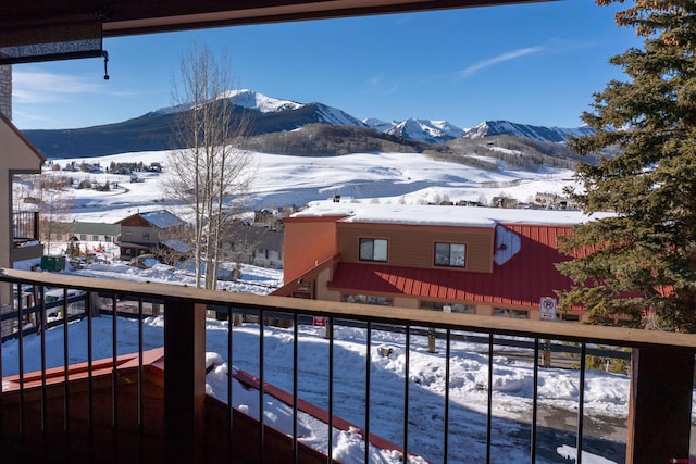 snow covered pool with a mountain view