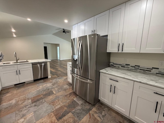 kitchen with sink, stainless steel appliances, white cabinetry, and ceiling fan