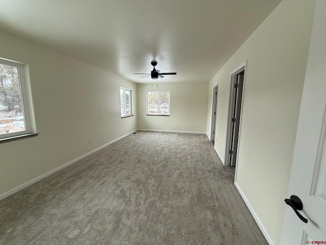 carpeted empty room with ceiling fan