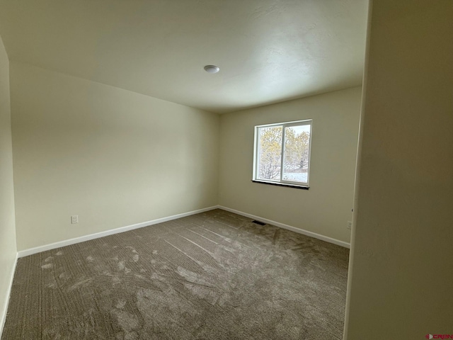 unfurnished room with carpet floors