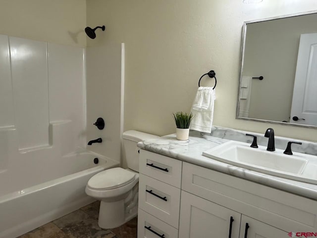 full bathroom featuring toilet, washtub / shower combination, and vanity