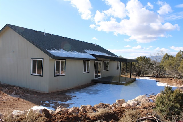 rear view of house with a wooden deck