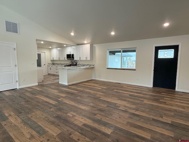 kitchen with white cabinetry, lofted ceiling, dark hardwood / wood-style flooring, and kitchen peninsula