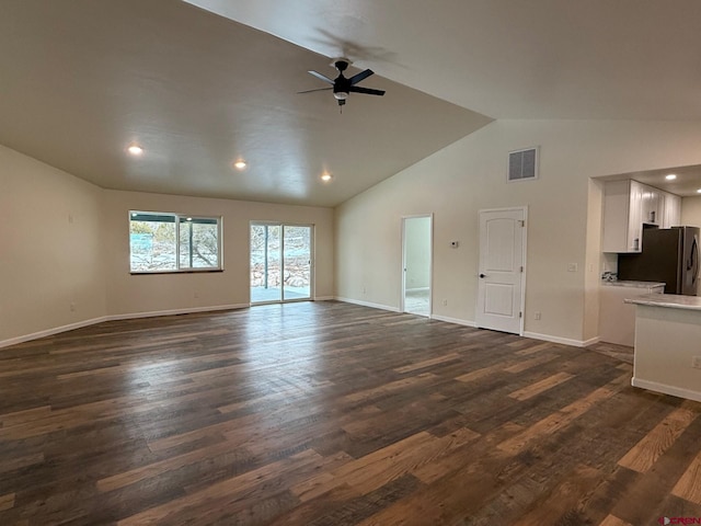 unfurnished living room with lofted ceiling, ceiling fan, and dark hardwood / wood-style flooring