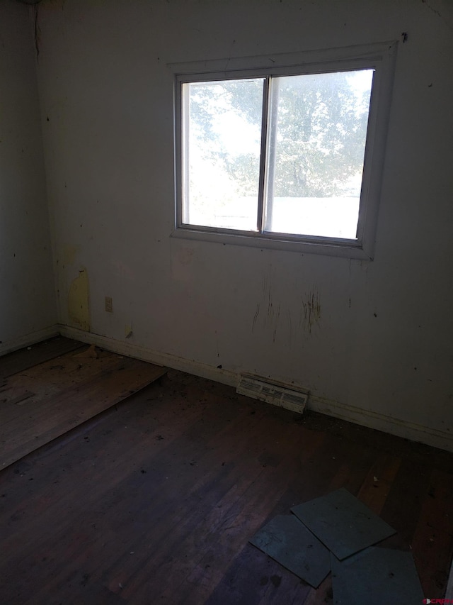 unfurnished room featuring hardwood / wood-style flooring